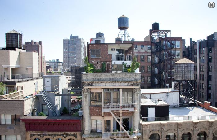 a view of the city from the roof of a building